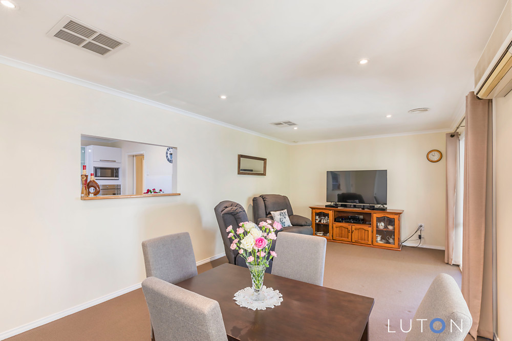 Living Room With Table and Flower